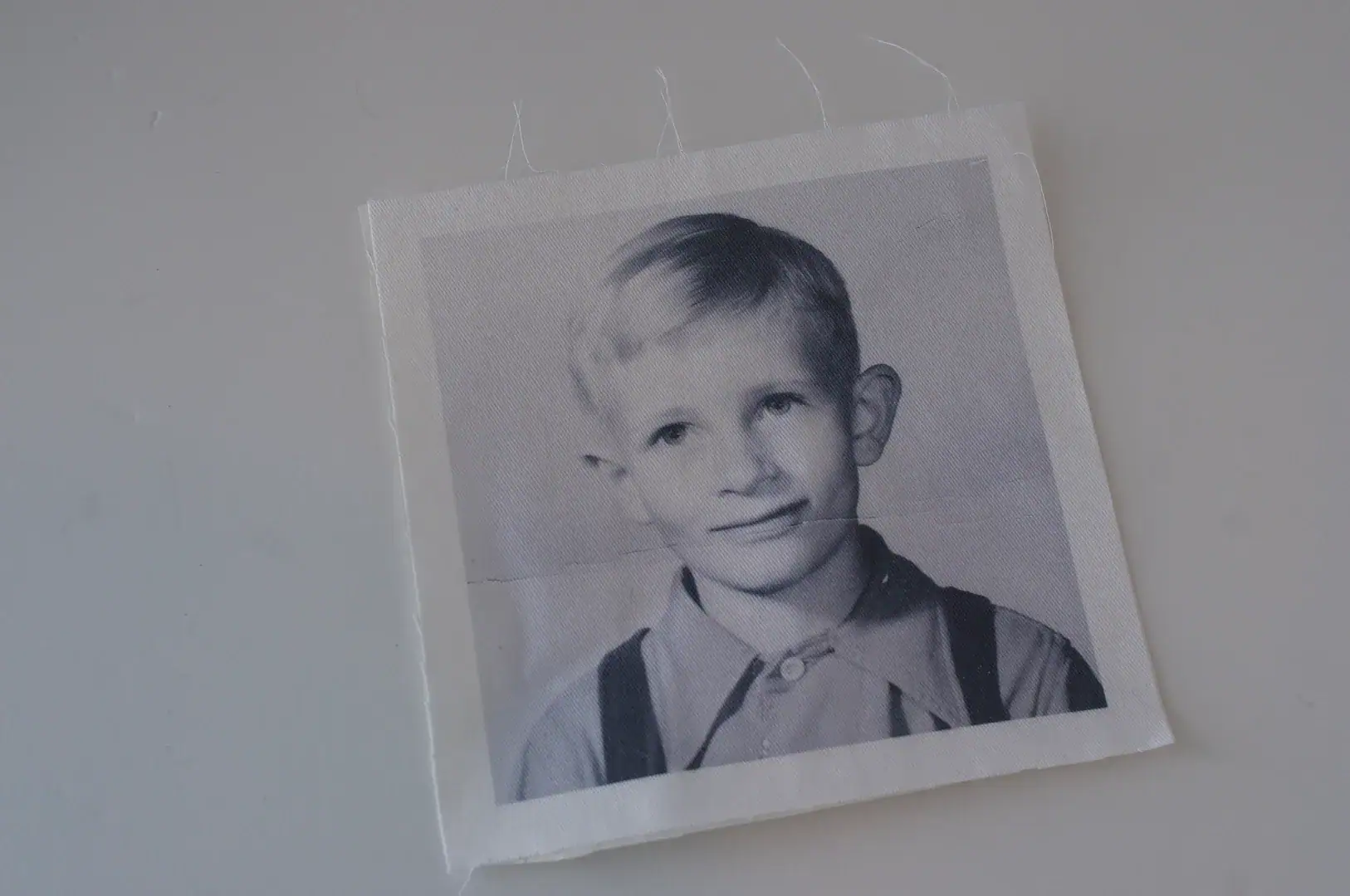 vintage photo printed out on fabric on white table