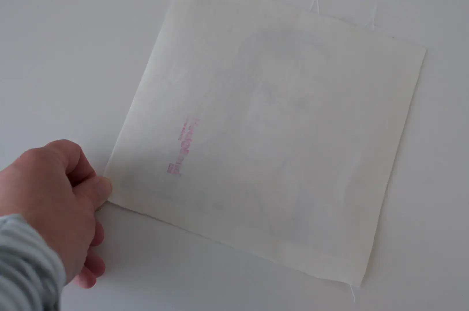 iron on paper on white table