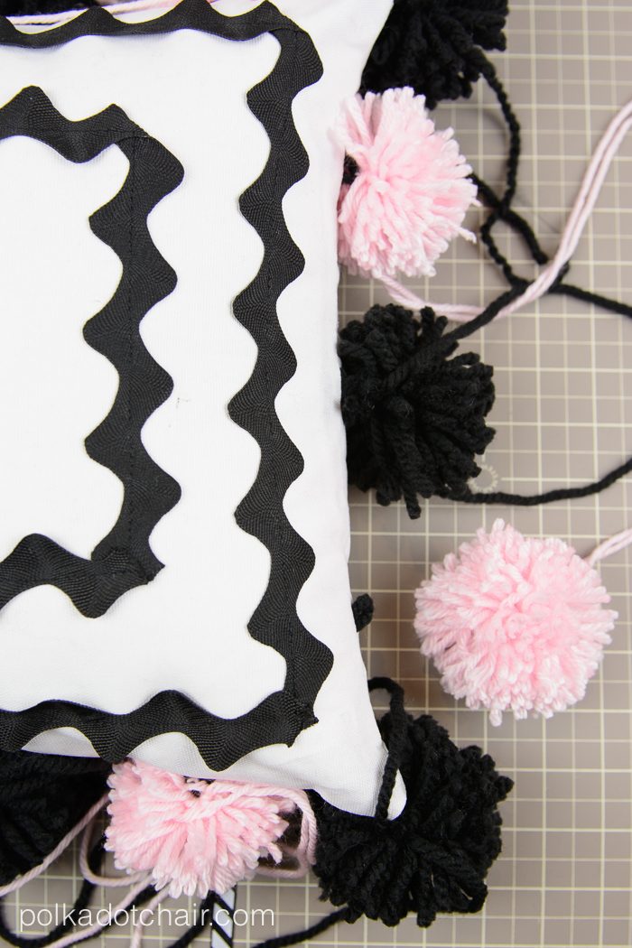 Cute DIY Pom Pom Pillow by Melissa Mortenson of polkadotchair.com