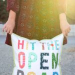 Free tutorial for a Hit the Open Road pillow, a fun DIY project for an RV or camper. Plus why our family loves to "Go RV'ing"