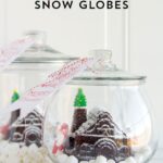 Cute idea for friend and neighbor Christmas gifts! A snow globe gingerbread house made with a simple mold. Post includes a link to the free printable tag.