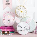 Introducing the Alice Bag Sewing Pattern. A whimsical and versatile purse sewing pattern featuring bunny ears! It can be made in two sizes and features 4 different handle style options including cross body straps!