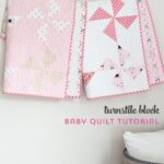 Free baby quilt patterns including this one for a simple baby quilt made using a Turnstile Quilt block! So easy you could make it in a day.