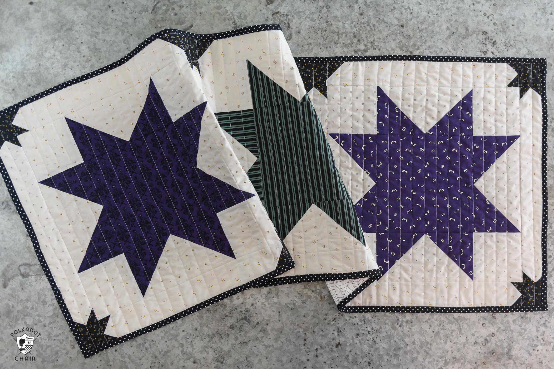 purple white and green halloween table runner on table