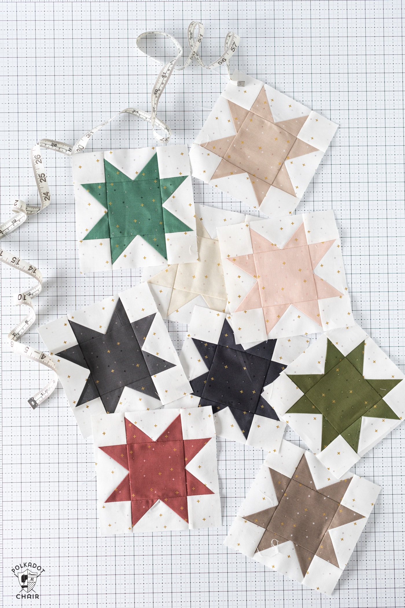 Multicolor star quilt blocks on white cutting mat