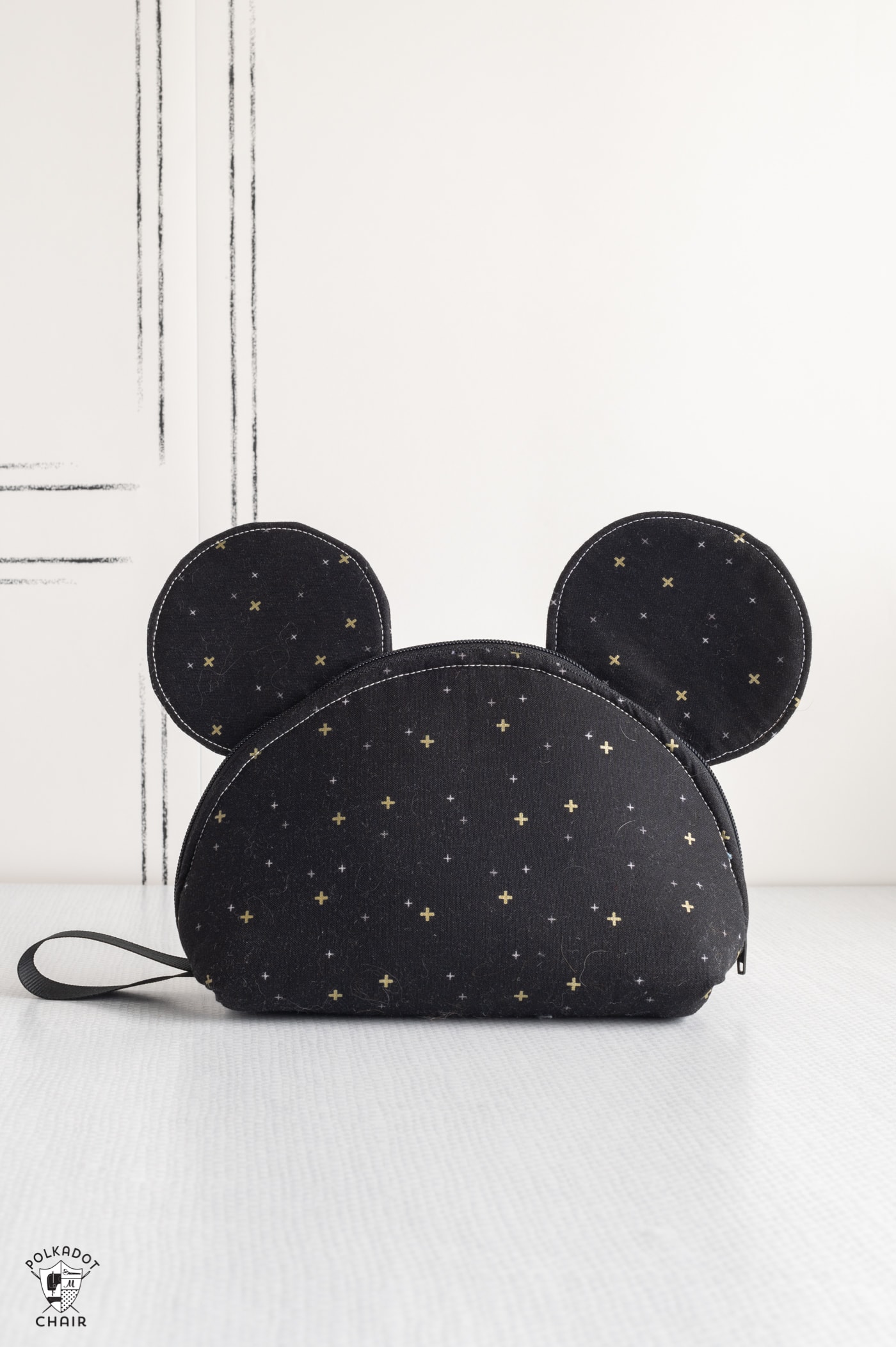black zip bag with mouse ears