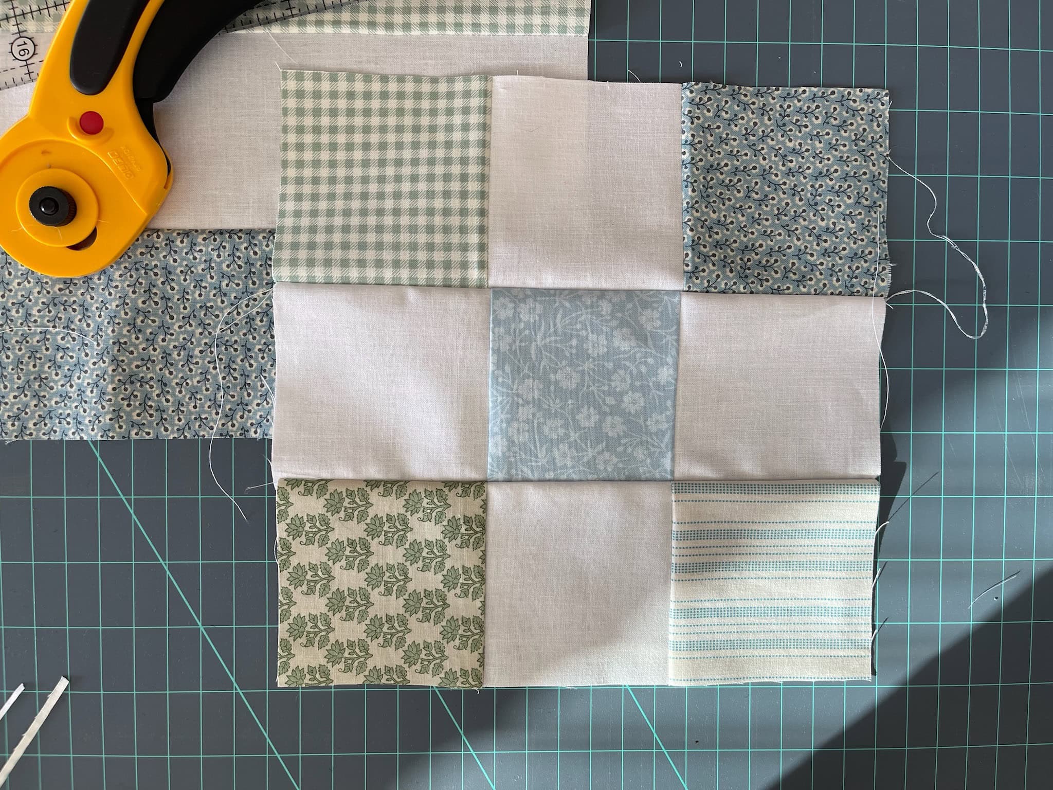 nine patch quilt on cutting mat