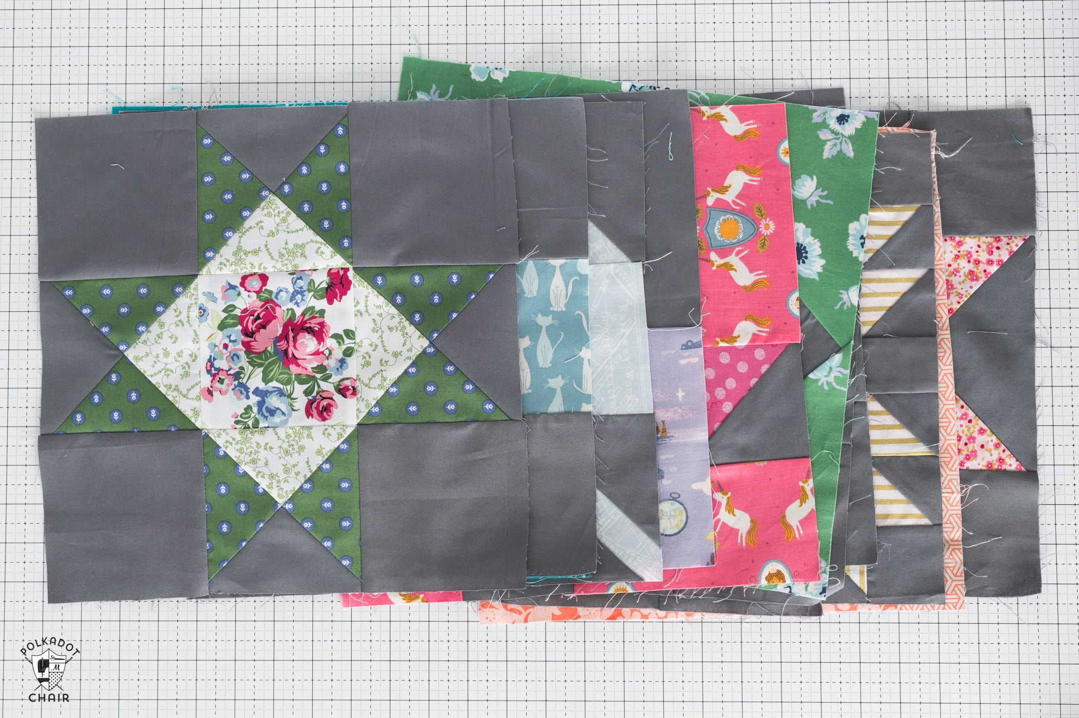 colorful quilt blocks on white cutting mat