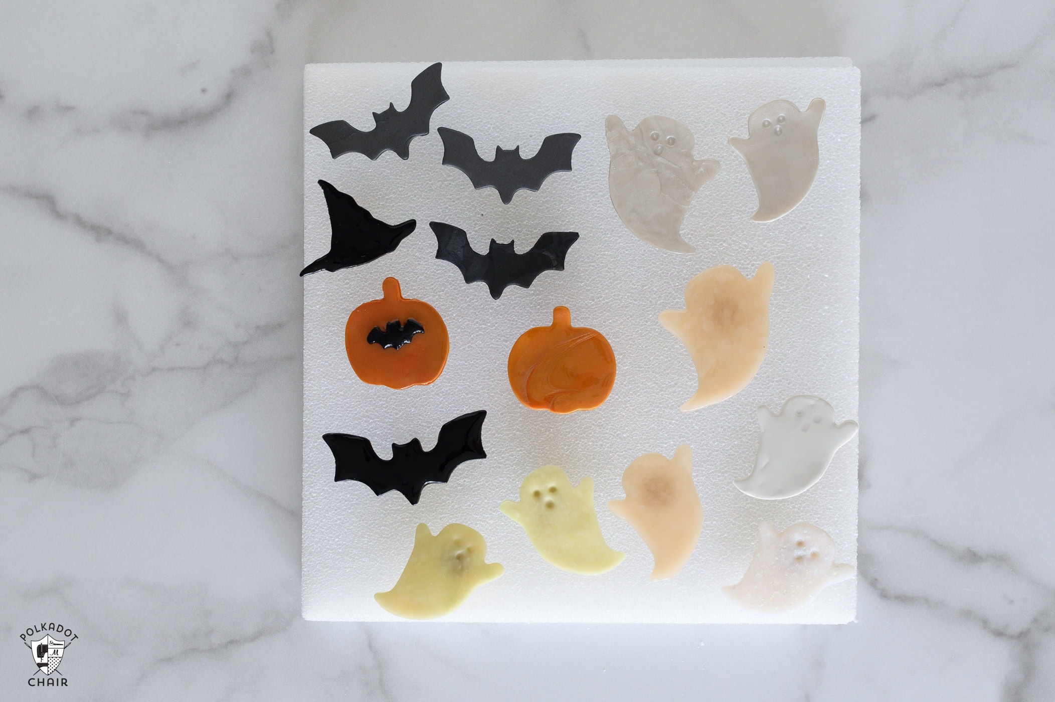 multiple clay halloween pins on table
