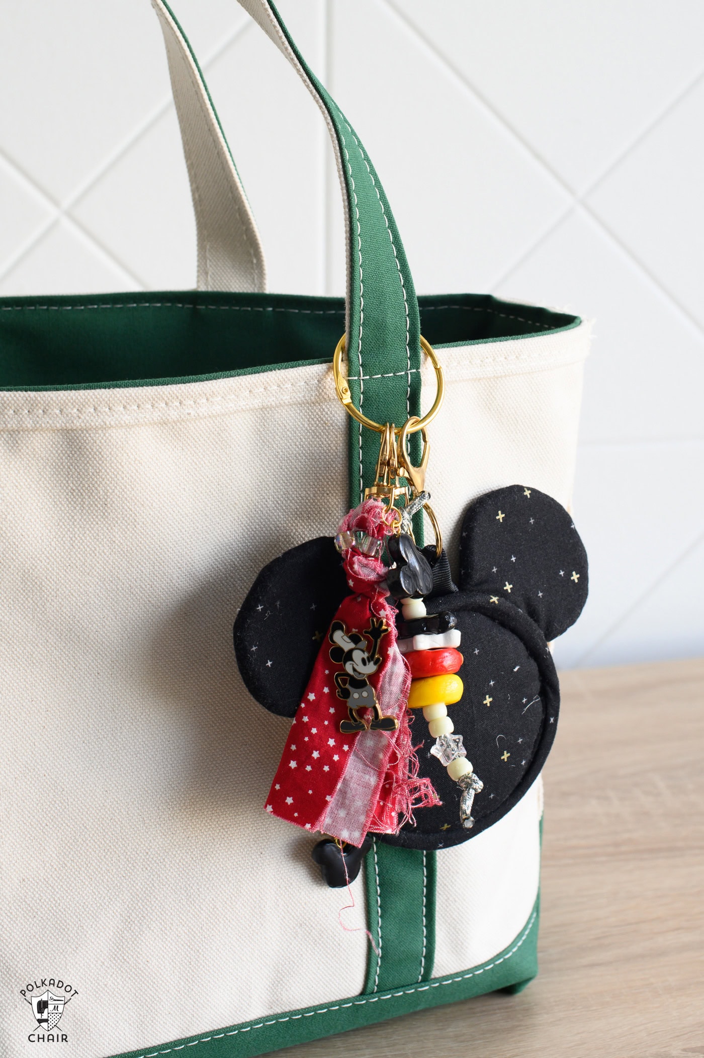 mickey shaped bag charm on canvas tote bag