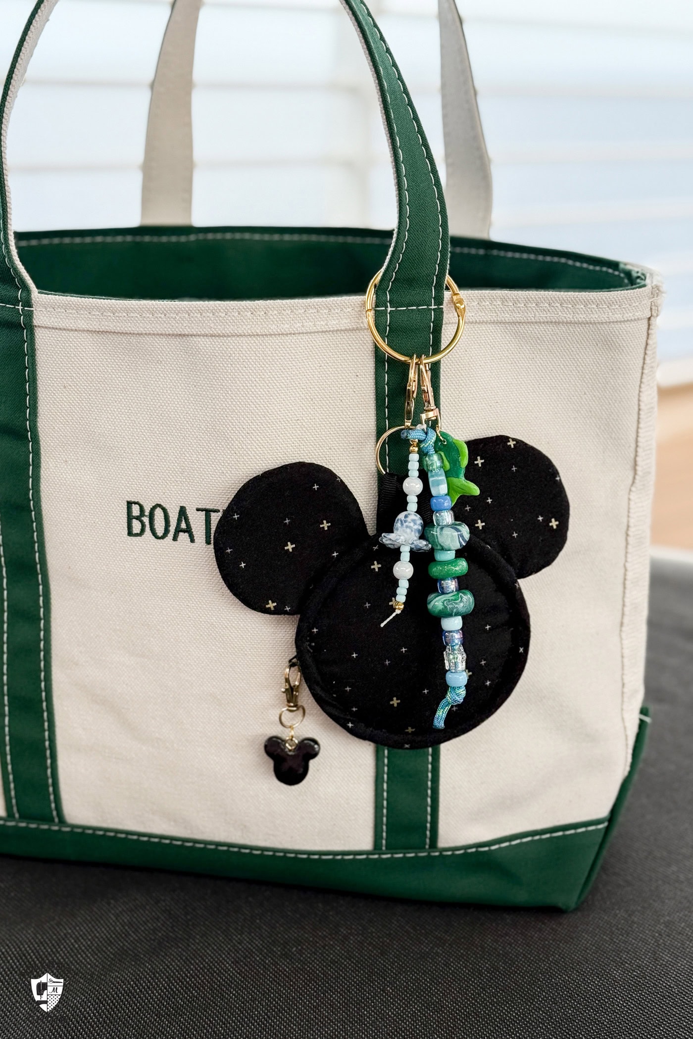 mickey shaped bag charm on canvas tote bag