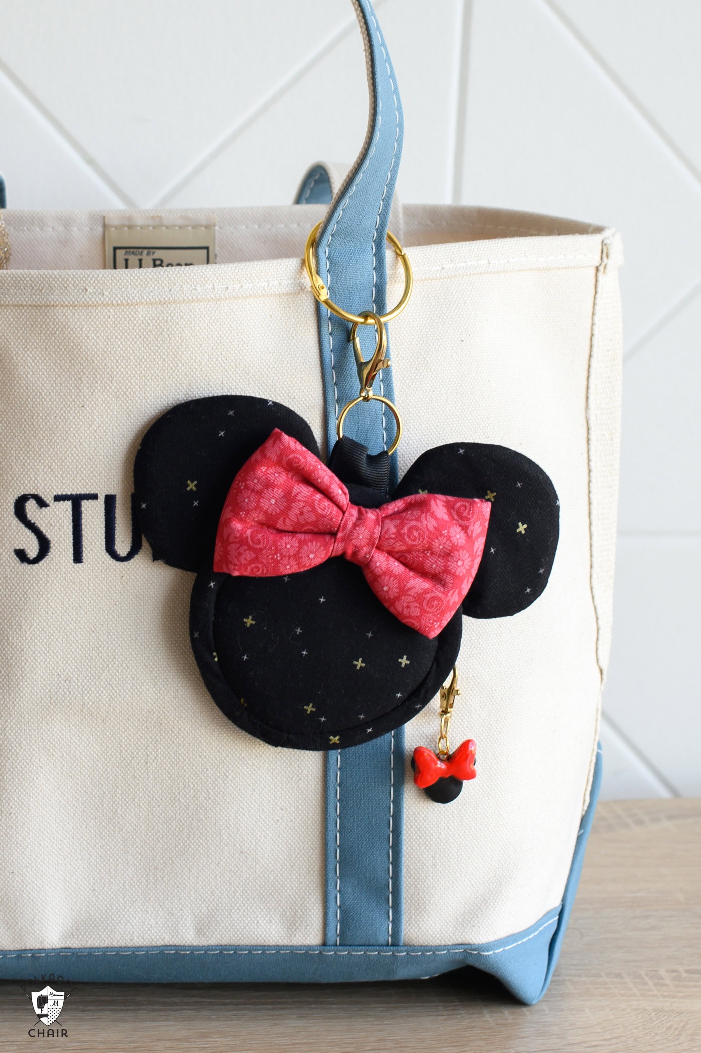 mickey shaped bag charm on canvas tote bag
