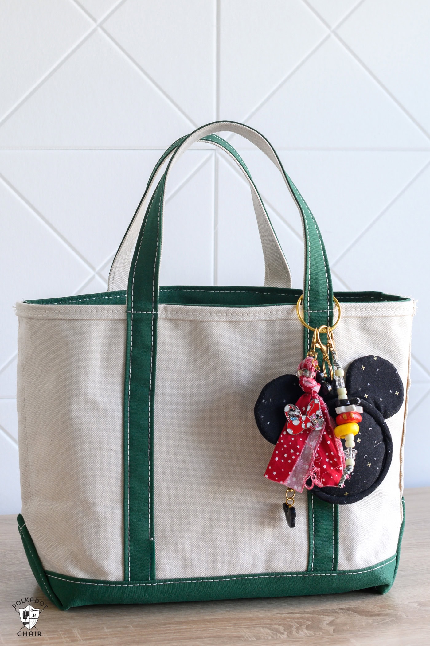mickey bag charm on green tote bag