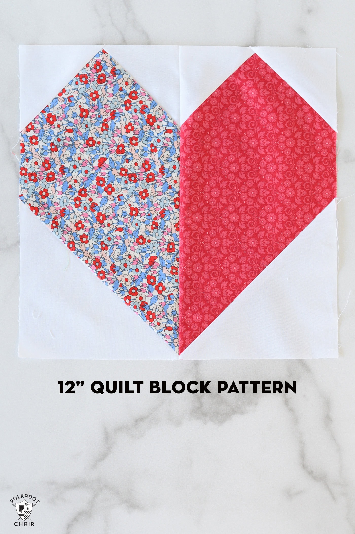 Pink and white heart quilt block on white table