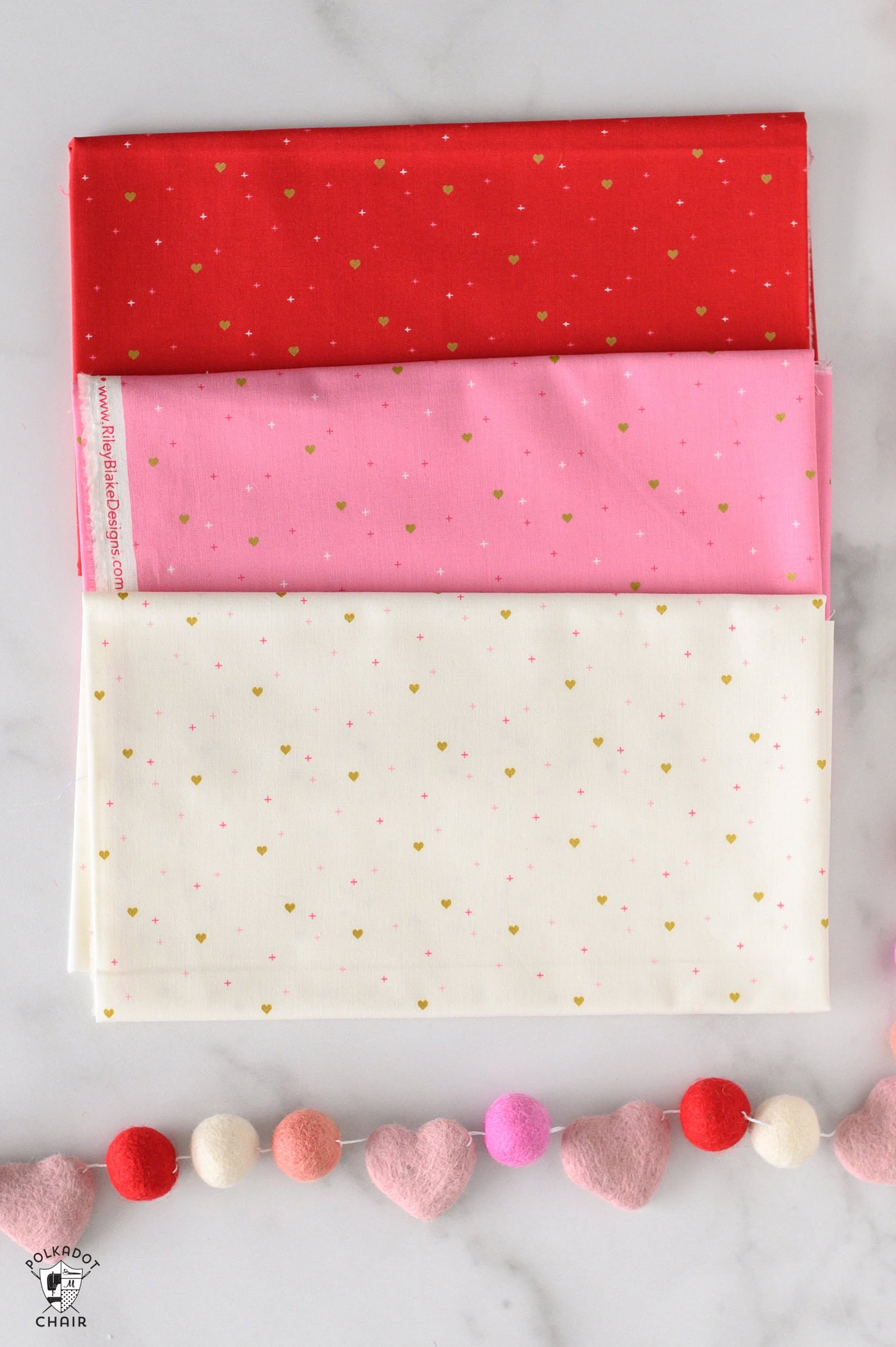 sparkler fabrics in bright colors folded on white marble table