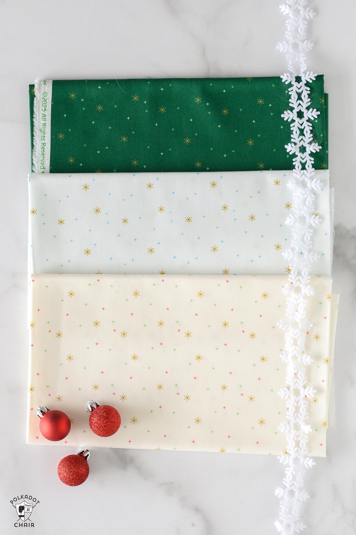 sparkler fabrics in bright colors folded on white marble table