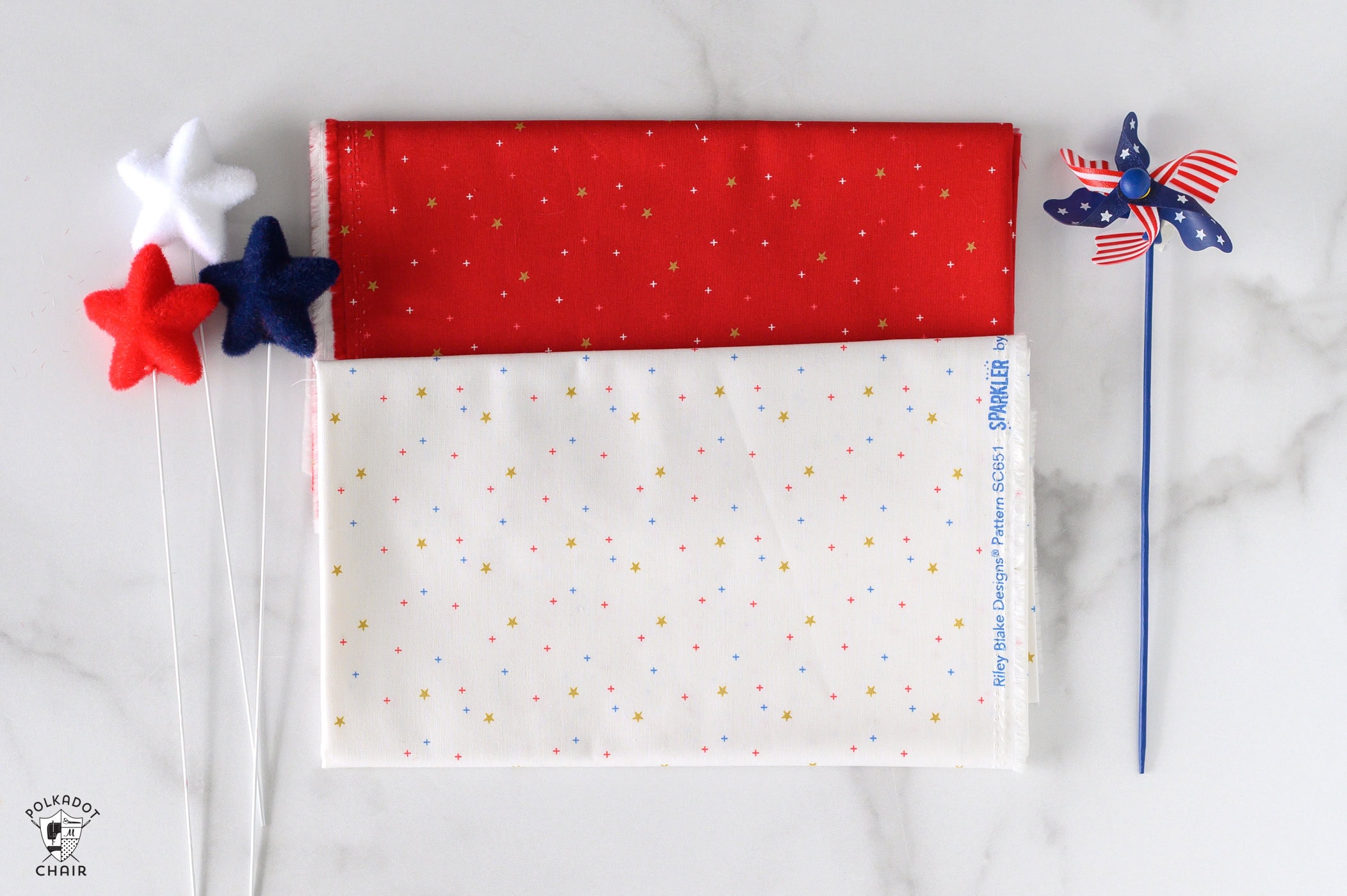 sparkler fabrics in bright colors folded on white marble table