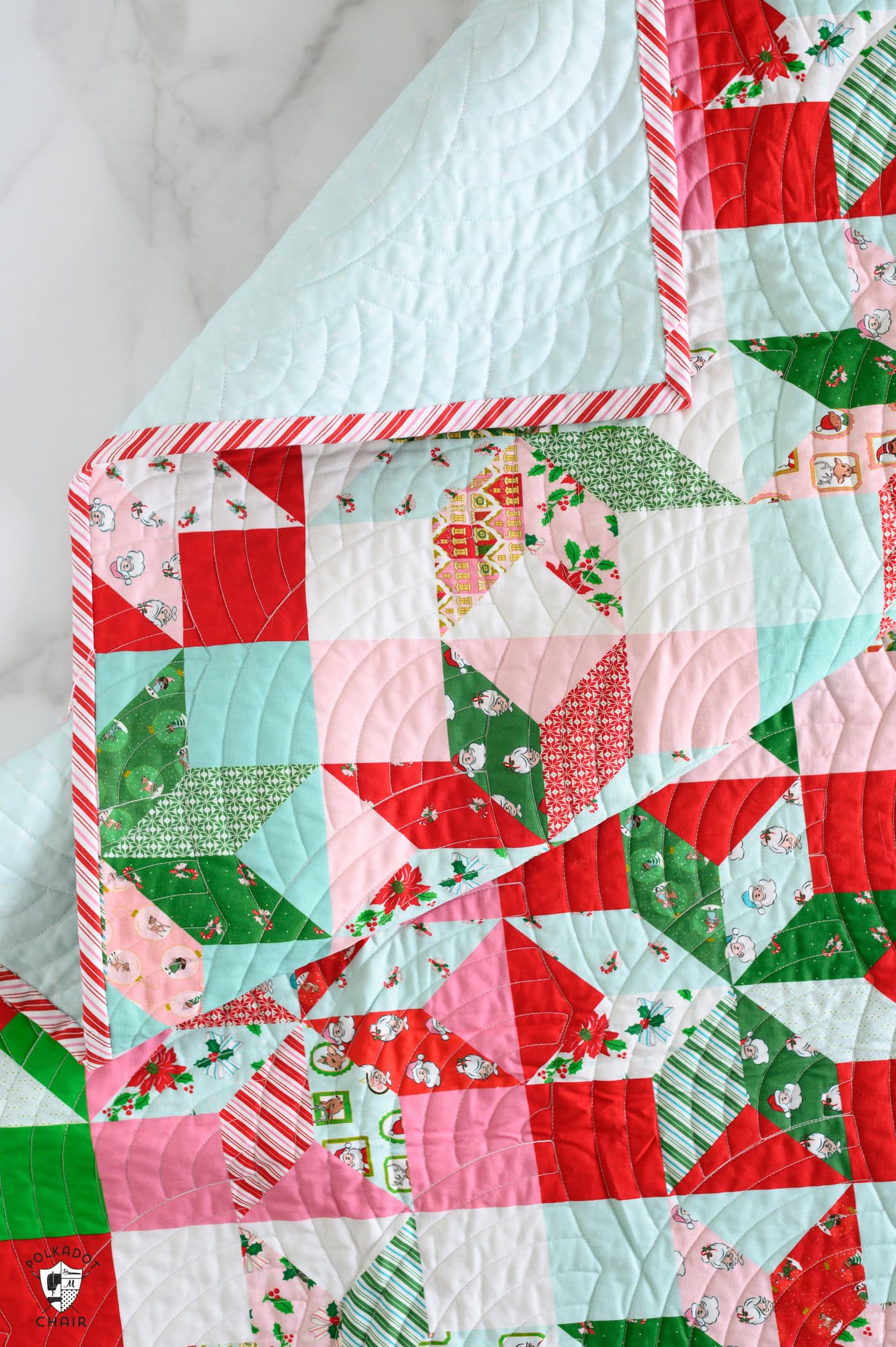 pink, red, green and white star christmas quilt