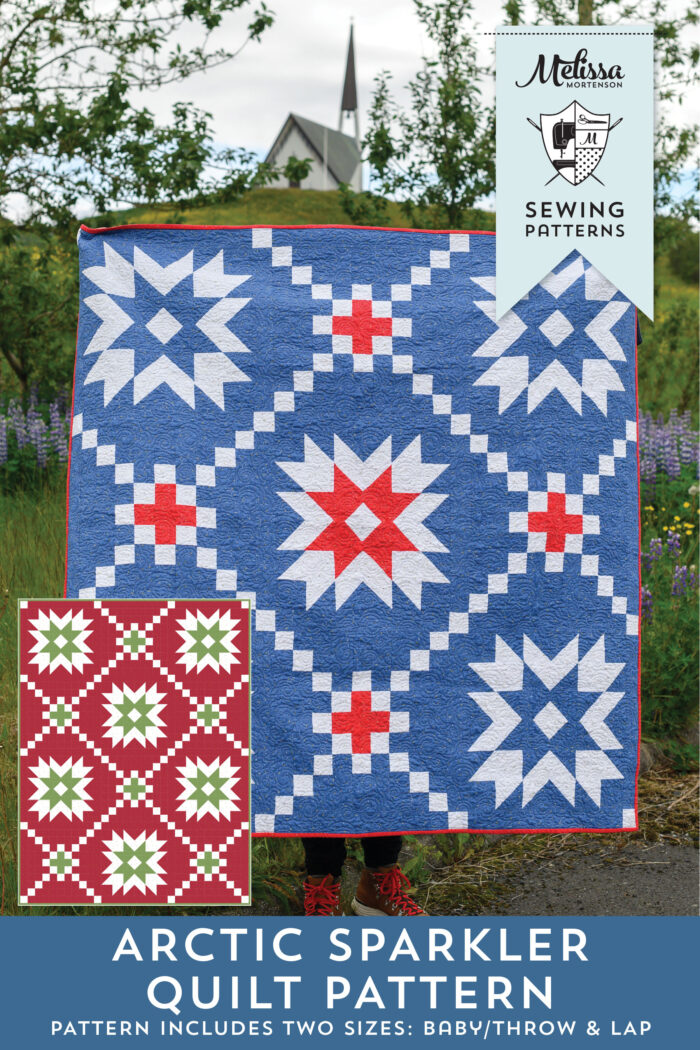 front cover of arctic sparkler quilt pattern - blue, red and white star quilt pattern in front of church outdoors