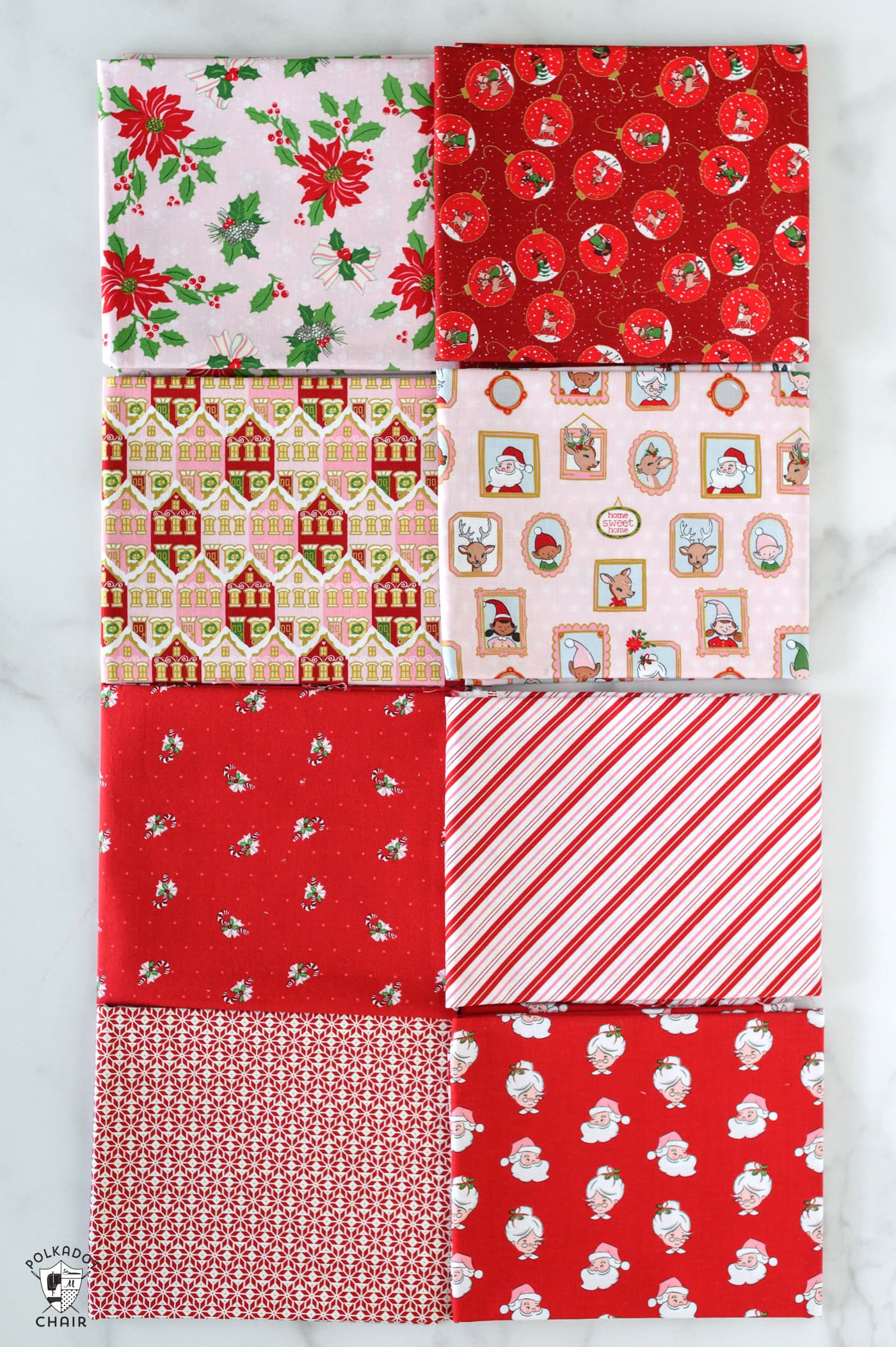 red and pink christmas fabric folded on white table