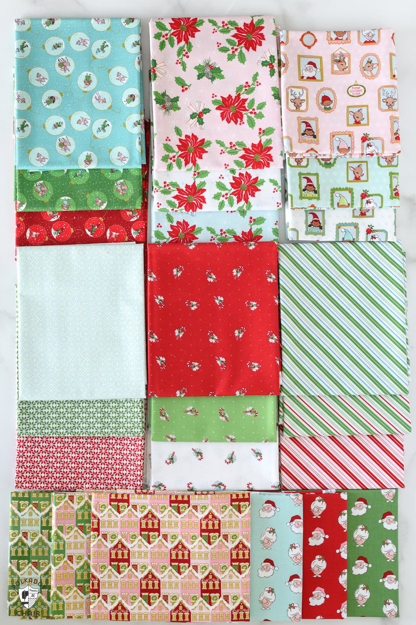 red and pink christmas fabric folded on white table