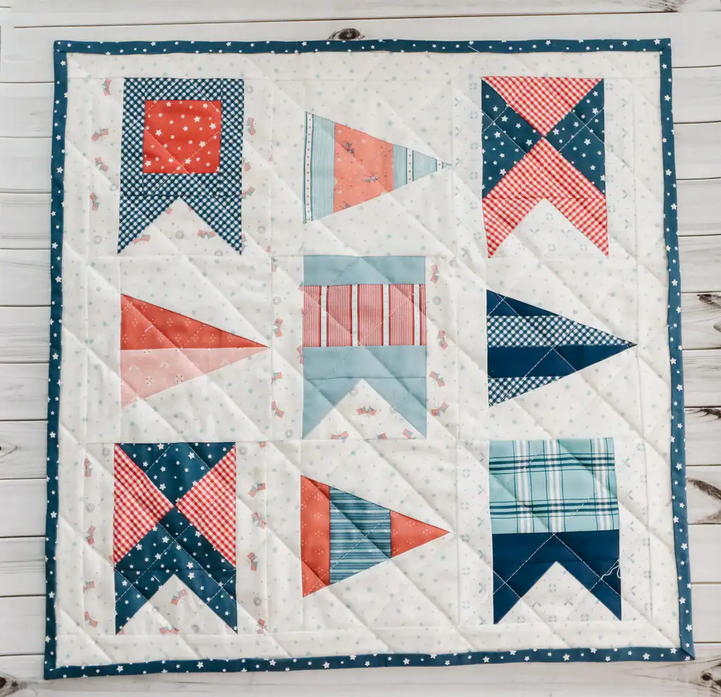 mini quilt made with red, blue and white nautical flag quilt blocks