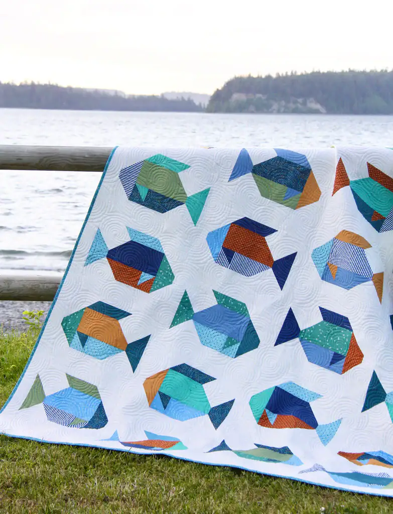 fish quilt on fence outdoors