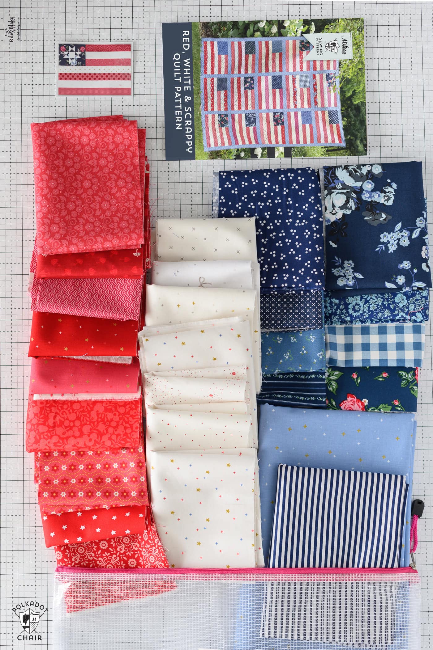 Red, white and blue fabrics folded on cutting table with bag