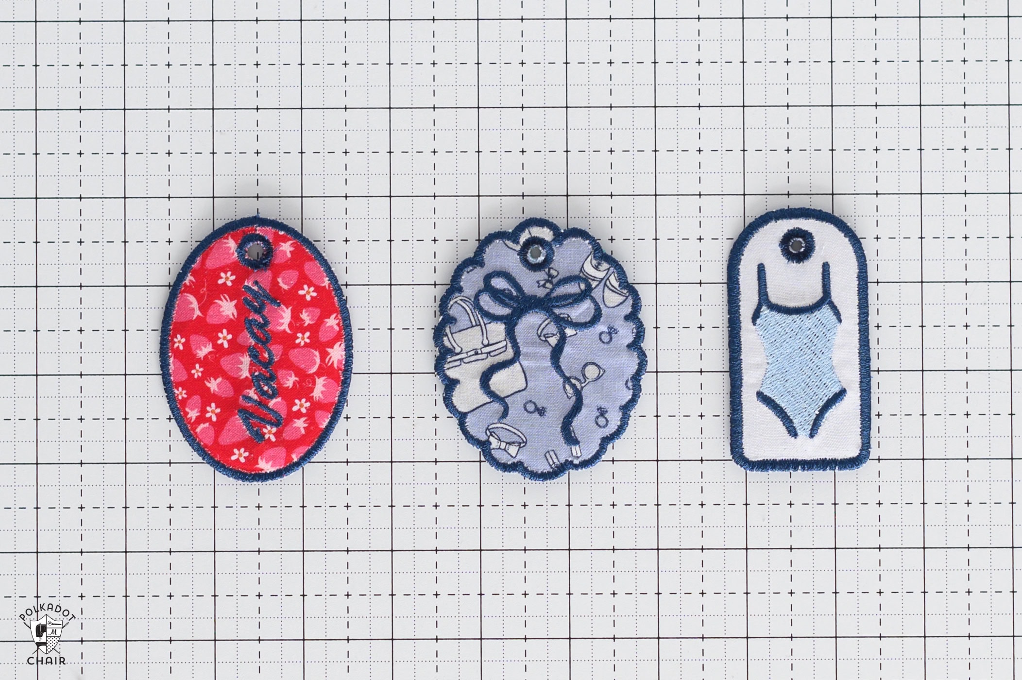three embroidered tags on the back.
