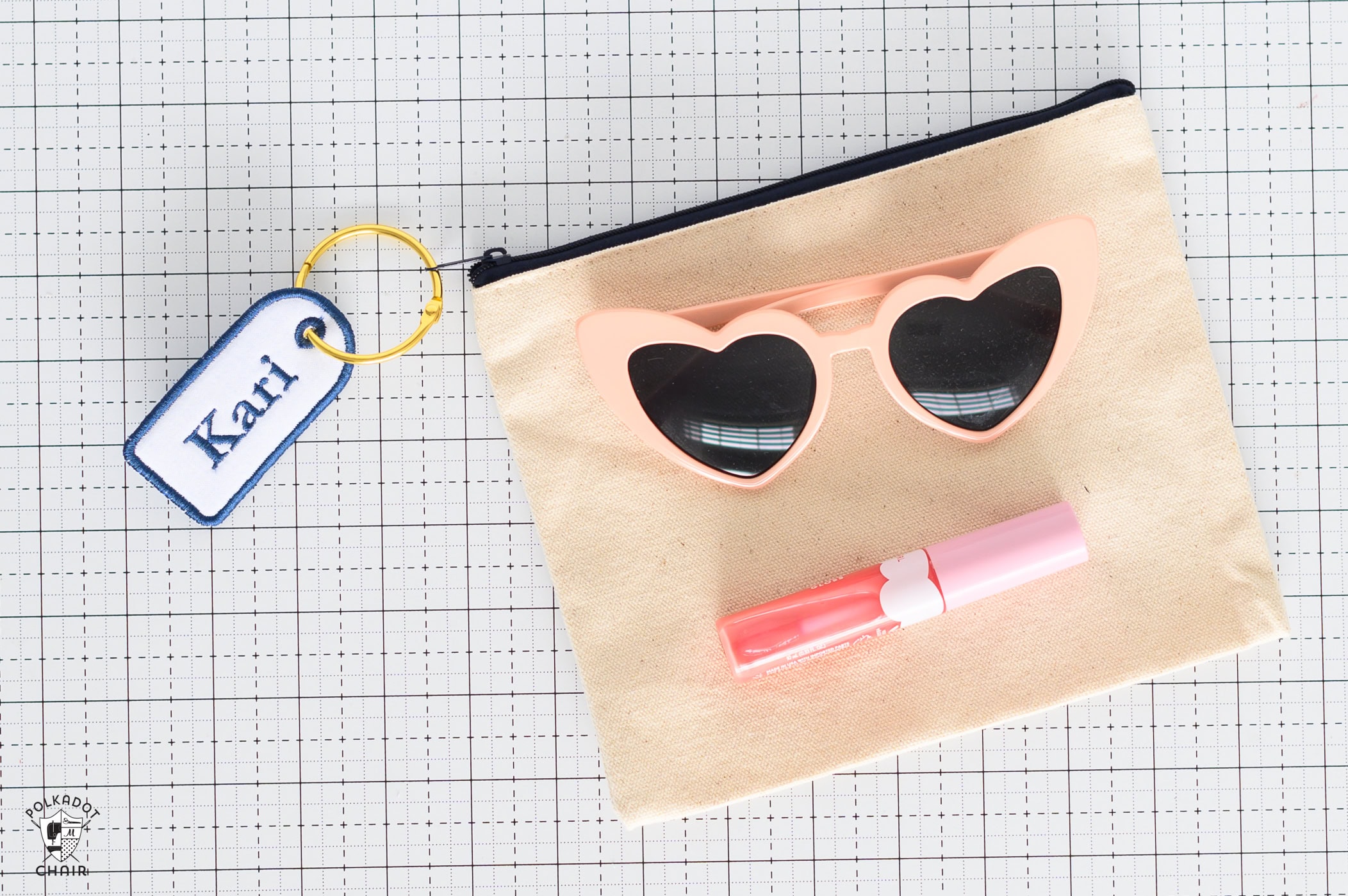 embroidered name tag on canvas pouch.