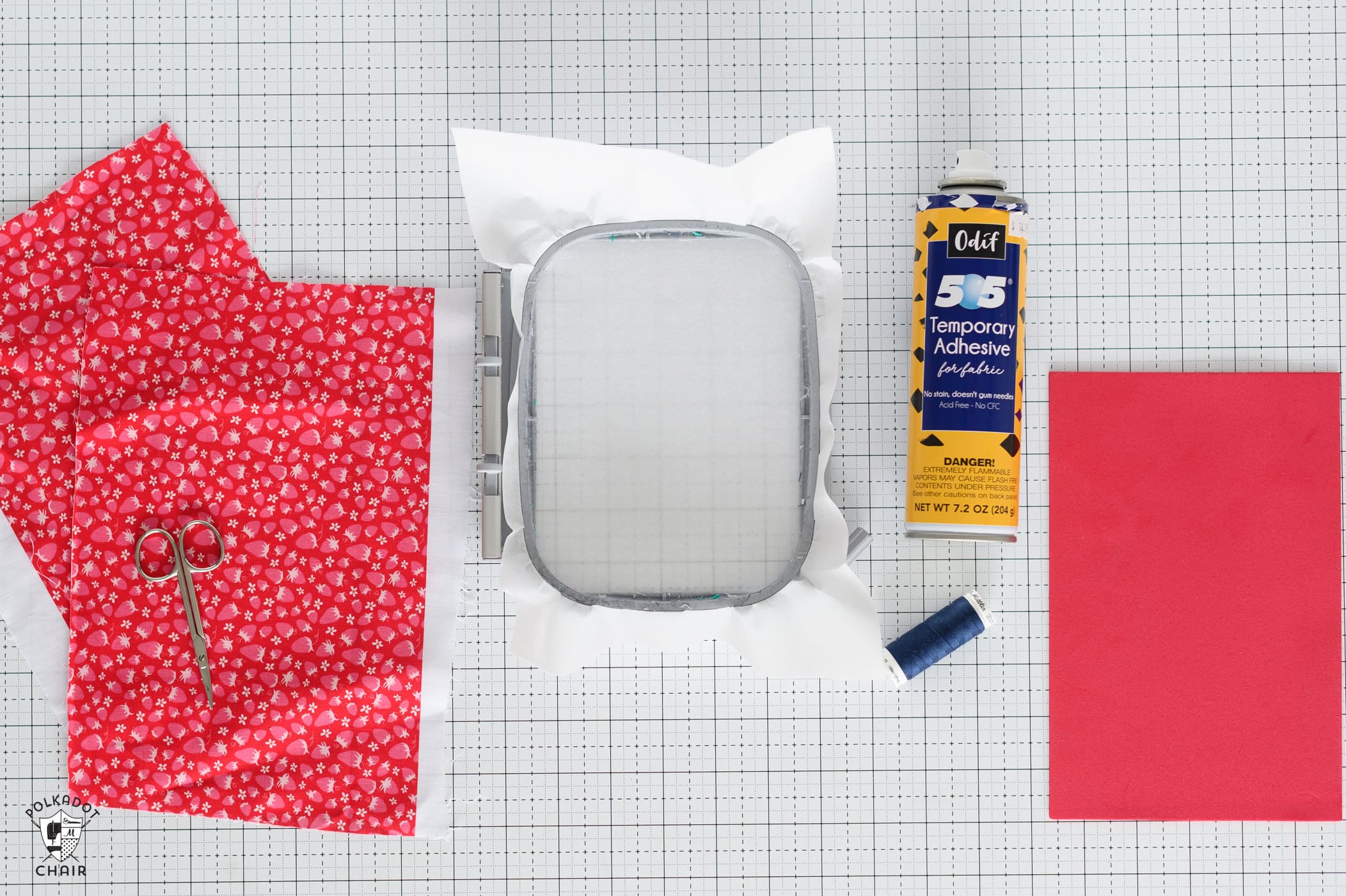 red fabric, scissors, embroidery hoop, thread, basting spray and red foam.