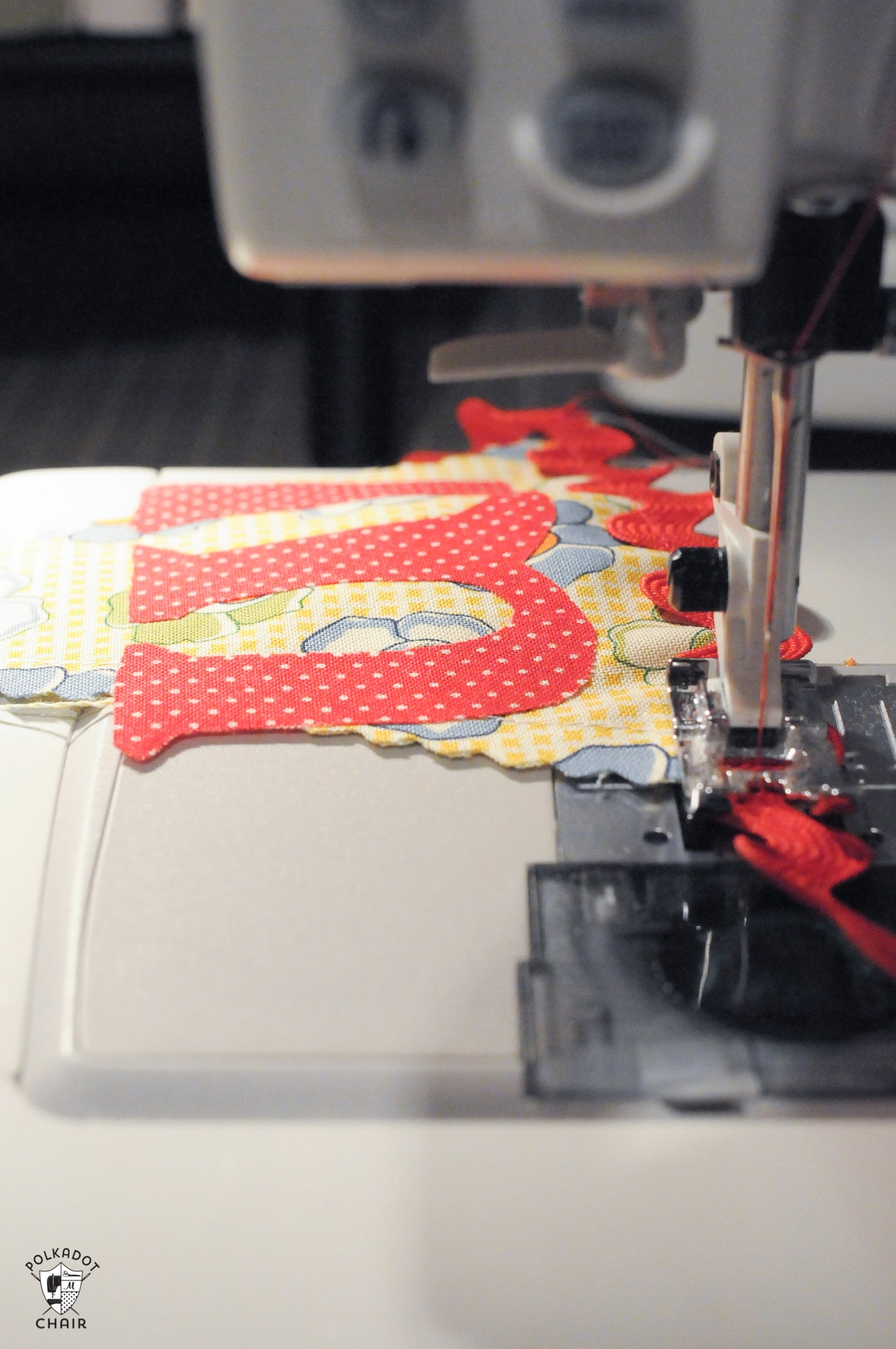 fabric banner being sew on sewing machine