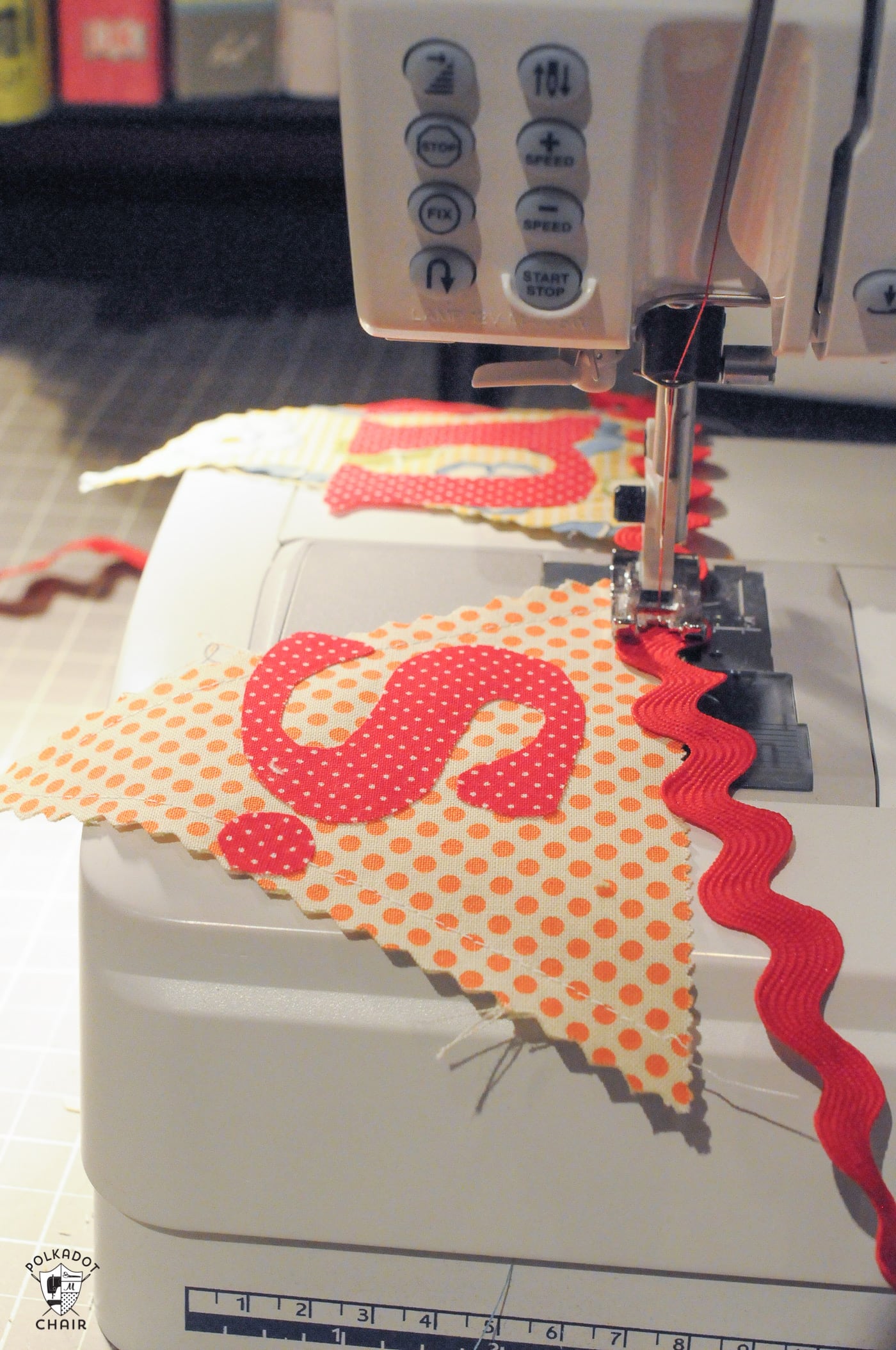 fabric banner being sew on sewing machine