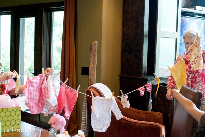 Adorable Baby Shower Gift idea- give the new mom a "clothesline" of baby gifts!