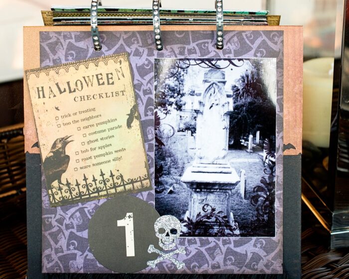 close up of page of collage scrapbook flip book- Halloween paper and stickers with black and white photos