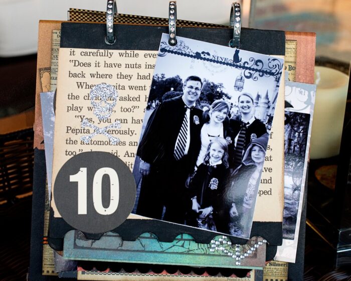 close up of page of collage scrapbook flip book- Halloween paper and stickers with black and white photos