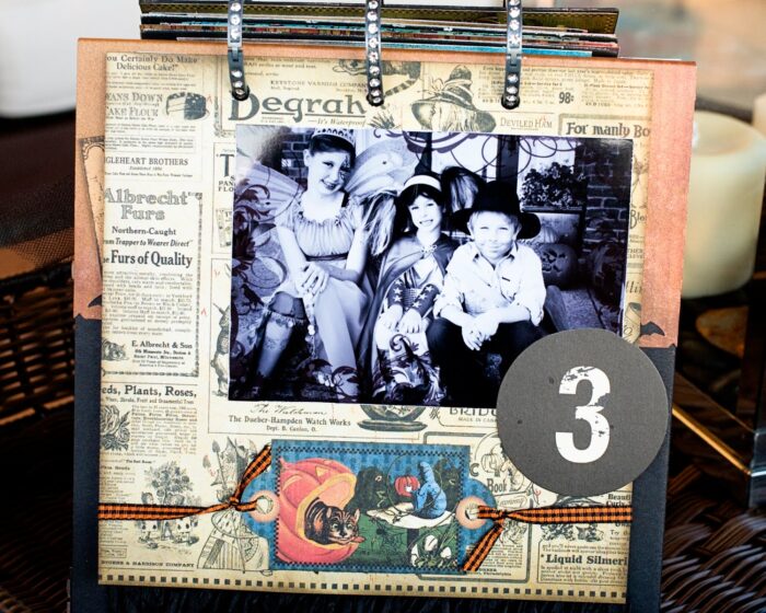 close up of page of collage scrapbook flip book- Halloween paper and stickers with black and white photos