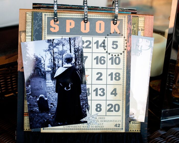 close up of page of collage scrapbook flip book- Halloween paper and stickers with black and white photos