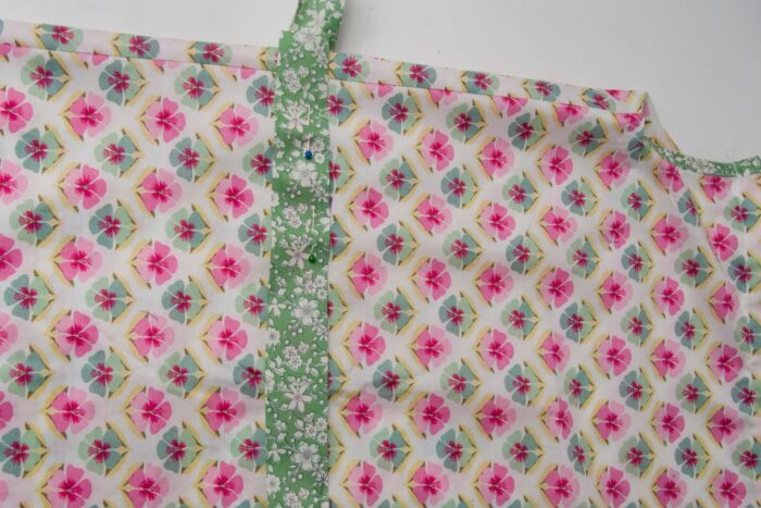 green fabric on floral fabric on white table