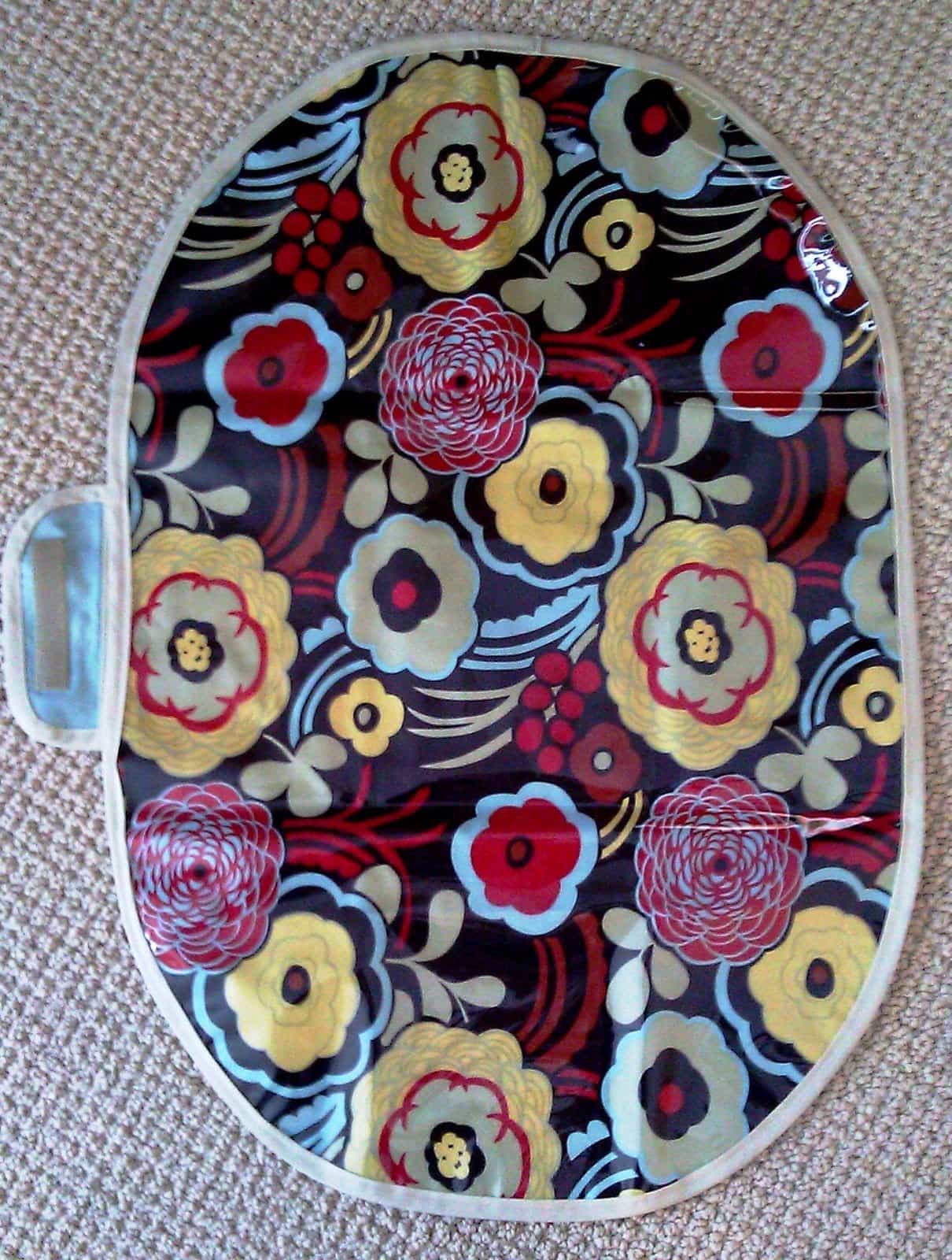 floral changing pad on gray blanket