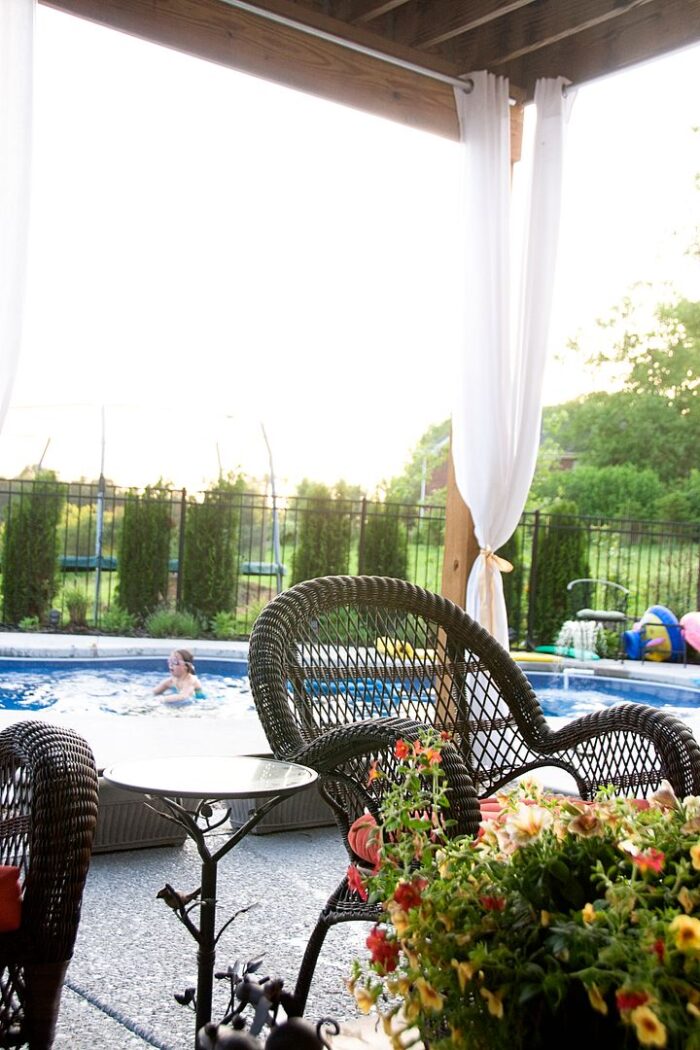 wicker rocking chair and pool