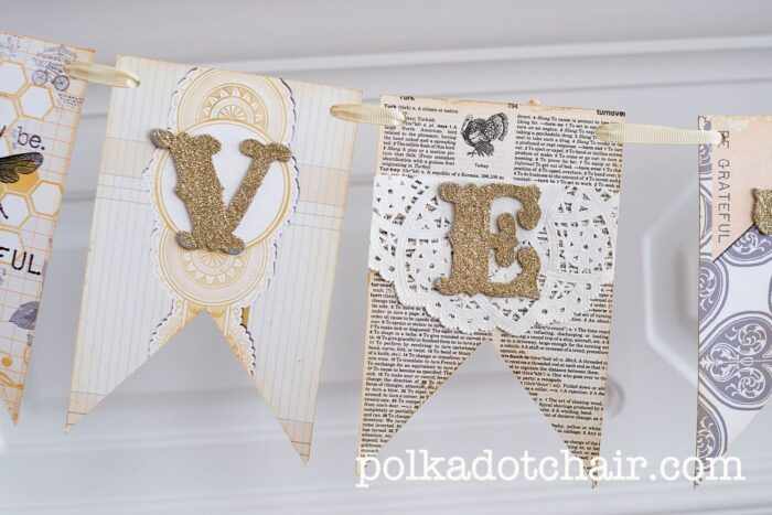 close up of book page banner with gold glitter letters