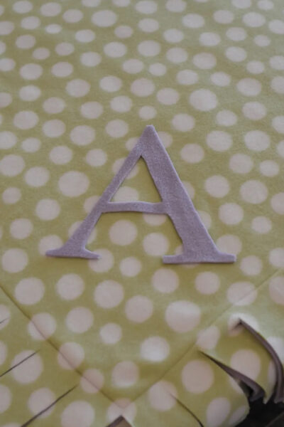 pink and gree fleece blanket under construction