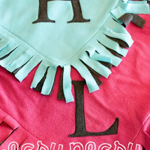 pink and gree fleece blanket under construction