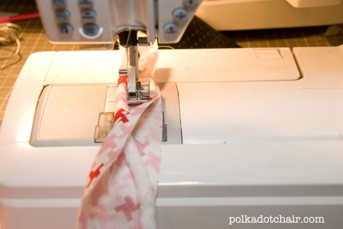 piping under sewing machine foot