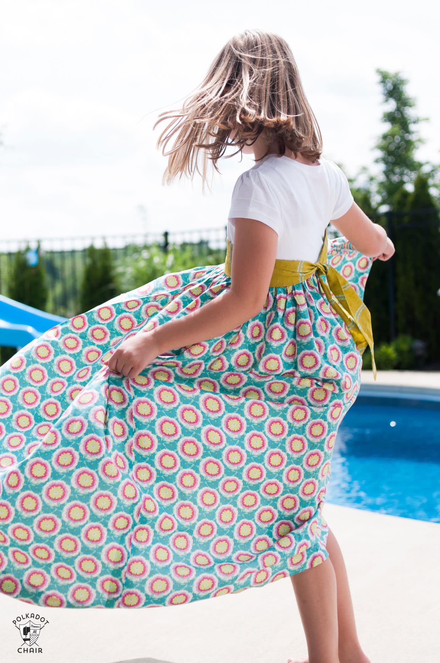 Upcycle a T-shirt into a girls maxi dress with this sewing tutorial. A free pattern for a t-shirt maxi dress on polkadotchair.com