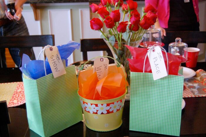 3 gift bags on table with flowers