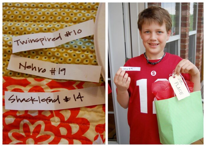 paper on table cloth and kid holding paper and a bag