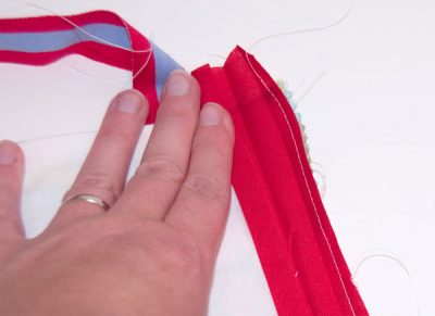 Ribbon being sewn to fabric