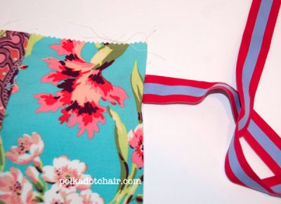 Ribbon sewn to fabric on white table